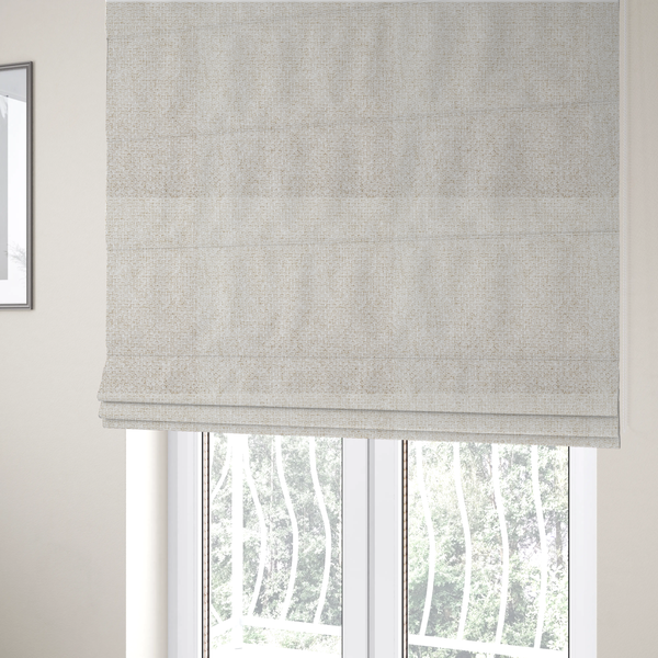 The fabric used to create these Roman blinds is a tightly woven fabric in a clean, bright off-white or light ivory shade, featuring a distinct, structured basket-weave pattern.