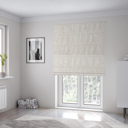 The fabric used to create these Roman blinds is a tightly woven fabric in a clean, bright off-white or light ivory shade, featuring a distinct, structured basket-weave pattern.