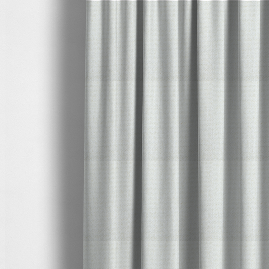 The fabric used to create these made-to-measure curtains is a tightly woven fabric in a clean, crisp off-white or light cream shade, featuring a distinct, structured basket-weave pattern.