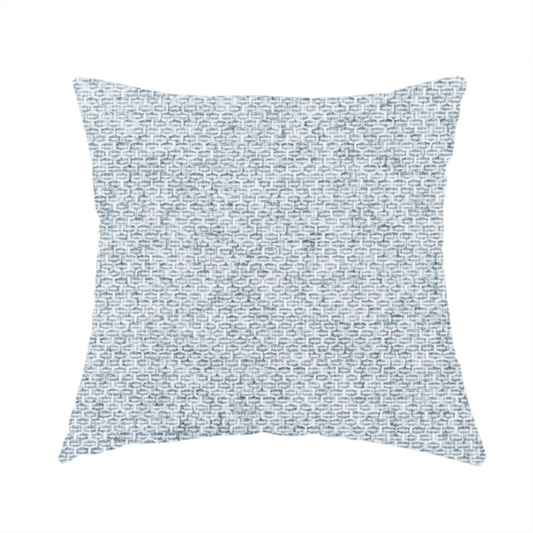 The fabric used to create these handmade cushions is a tightly woven fabric in a soft, cool-toned sky blue and white blend, featuring a distinct, structured basket-weave pattern.
