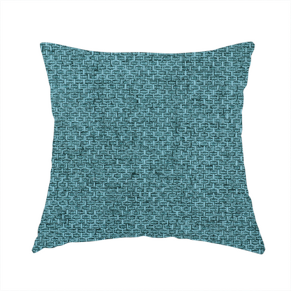 The fabric used to create this handmade cushion is a tightly woven fabric in a deep, cool-toned teal or seafoam blue, featuring a distinct, structured basket-weave pattern.