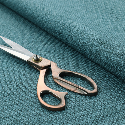 A tightly woven fabric in a deep, cool-toned teal or seafoam blue, featuring a distinct, structured basket-weave pattern.