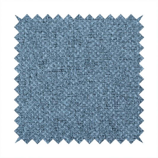A tightly woven fabric in a cool, muted slate blue, featuring a distinct, structured basket-weave pattern.
