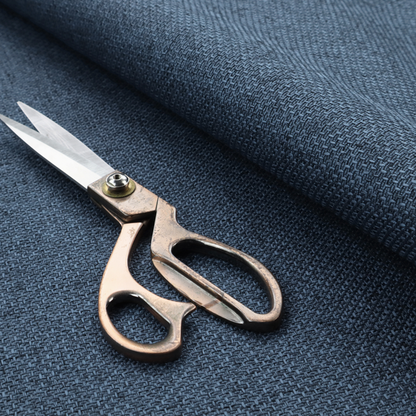 A tightly woven fabric in a deep, sophisticated navy blue, featuring a distinct, structured basket-weave pattern.