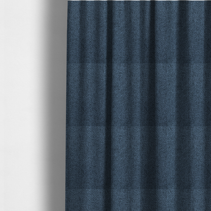 The fabric used to create these made-to-measure curtains is a tightly woven fabric in a deep, sophisticated navy blue, featuring a distinct, structured basket-weave pattern.
