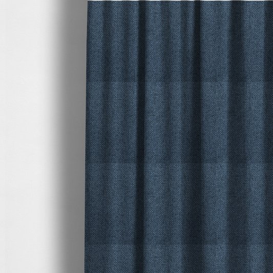 The fabric used to create these made-to-measure curtains is a tightly woven fabric in a deep, sophisticated navy blue, featuring a distinct, structured basket-weave pattern.