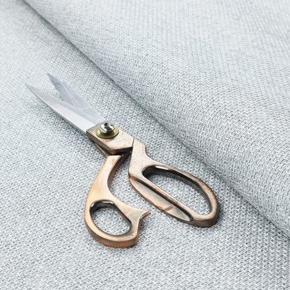 A tightly woven fabric in a bright, airy, and cool-toned silvery white, featuring a distinct, structured basket-weave pattern.