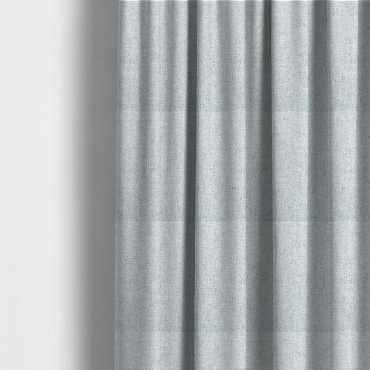 The fabric used to create these made-to-measure curtains is a tightly woven fabric in a bright, airy, and cool-toned silvery white, featuring a distinct, structured basket-weave pattern.