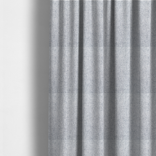 The fabric used to create these made-to-measure curtains is a tightly woven fabric featuring a blend of white and cool-toned grey threads, creating a soft, light heathered effect with a distinct, structured basket-weave pattern.