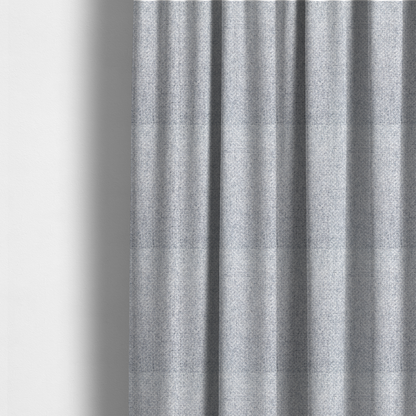 The fabric used to create these made-to-measure curtains is a tightly woven fabric featuring a blend of white and cool-toned grey threads, creating a soft, light heathered effect with a distinct, structured basket-weave pattern.