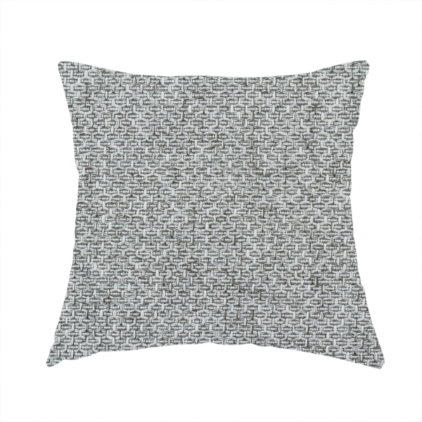 The fabric used to create this handmade cushion is a tight, woven texture with a neutral, monochromatic colour palette. The surface consists of a blend of light grey, charcoal, and white yarns interlocked in a repeating, small-scale geometric pattern.