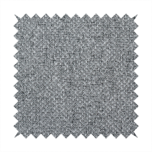 A durable, woven upholstery fabric featuring a monochromatic, heathered grey colour scheme. The weave is tight and consistent, characterized by an intricate, interlocking pattern of light, medium, and dark grey yarns that create a subtle, textured visual effect.