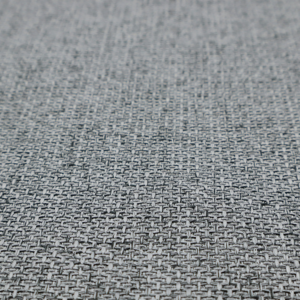 A durable, woven upholstery fabric featuring a monochromatic, heathered grey colour scheme. The weave is tight and consistent, characterized by an intricate, interlocking pattern of light, medium, and dark grey yarns that create a subtle, textured visual effect.