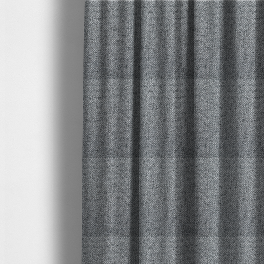 The fabric used to create these made-to-measure curtains is a durable, woven upholstery fabric featuring a monochromatic, heathered grey colour scheme. The weave is tight and consistent, characterized by an intricate, interlocking pattern of light, medium, and dark grey yarns that create a subtle, textured visual effect.