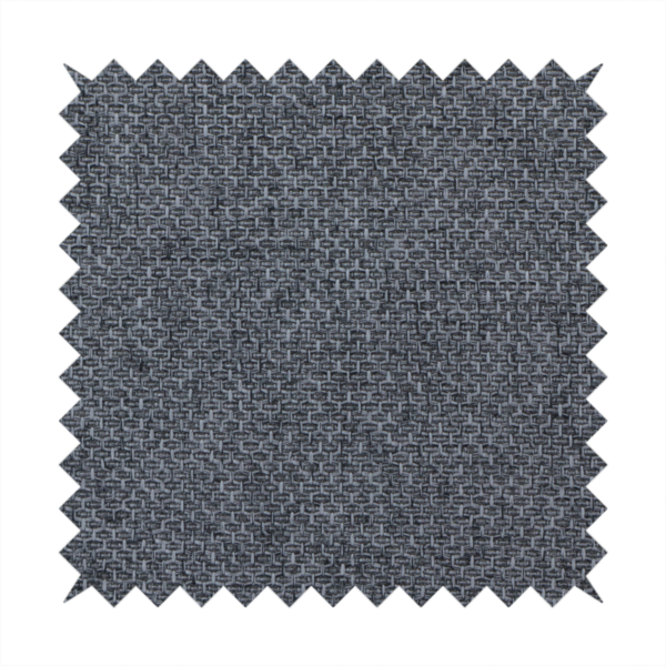 A sturdy, woven upholstery fabric in a deep, sophisticated charcoal grey. Like the previous samples, it features a tight, consistent weave with an interlocking geometric pattern.