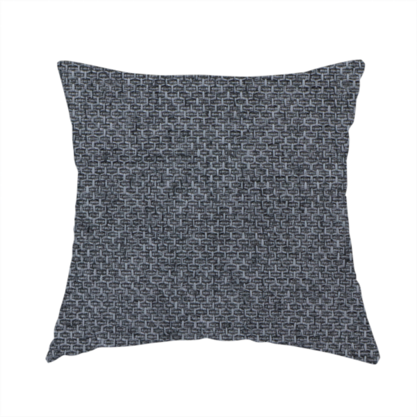 The fabric used to create this handmade cushion is a sturdy, woven upholstery fabric in a deep, sophisticated charcoal grey. Like the previous samples, it features a tight, consistent weave with an interlocking geometric pattern.