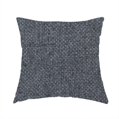 The fabric used to create this handmade cushion is a sturdy, woven upholstery fabric in a deep, sophisticated charcoal grey. Like the previous samples, it features a tight, consistent weave with an interlocking geometric pattern.