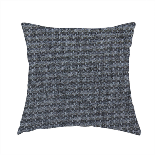 The fabric used to create this handmade cushion is a sturdy, woven upholstery fabric in a deep, sophisticated charcoal grey. Like the previous samples, it features a tight, consistent weave with an interlocking geometric pattern.