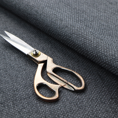 A sturdy, woven upholstery fabric in a deep, sophisticated charcoal grey. Like the previous samples, it features a tight, consistent weave with an interlocking geometric pattern.