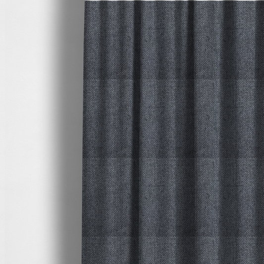 The fabric used to create these made-to-measure curtains is a  sturdy, woven upholstery fabric in a deep, sophisticated charcoal grey. Like the previous samples, it features a tight, consistent weave with an interlocking geometric pattern.
