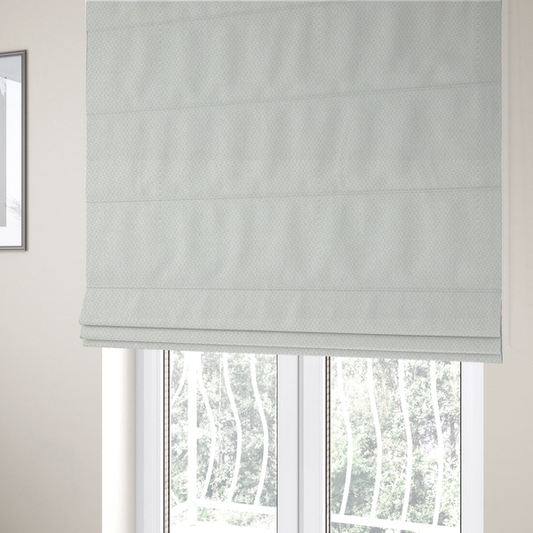 The fabric used to create these Roman blinds is a tight, basket weave-style construction in an off-white or cream colour.