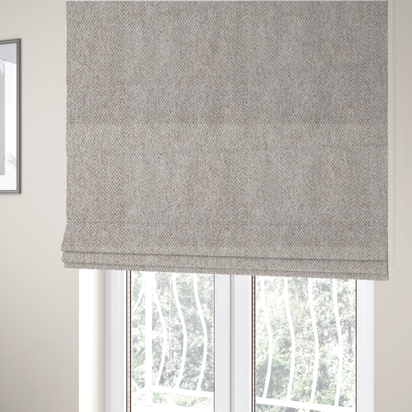 The fabric used to create these Roman blinds is a multi-tonal, textured basket weave in a sophisticated blend of beige, taupe, and off-white yarns.
