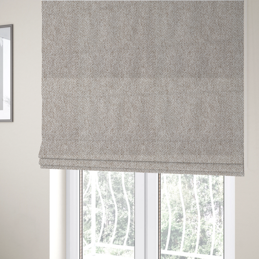 The fabric used to create these Roman blinds is a multi-tonal, textured basket weave in a sophisticated blend of beige, taupe, and off-white yarns.