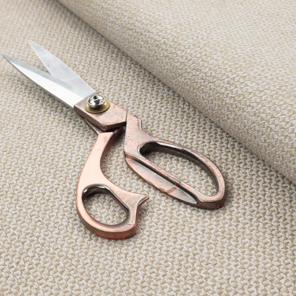This fabric features a tight, structured basket weave in a soft, warm sand or light tan tone.