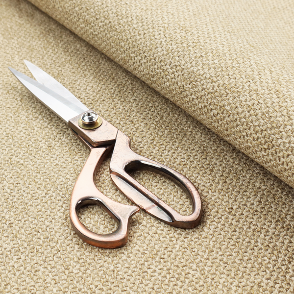 This fabric features a rich, multidimensional basket weave in warm, golden-tan tones.