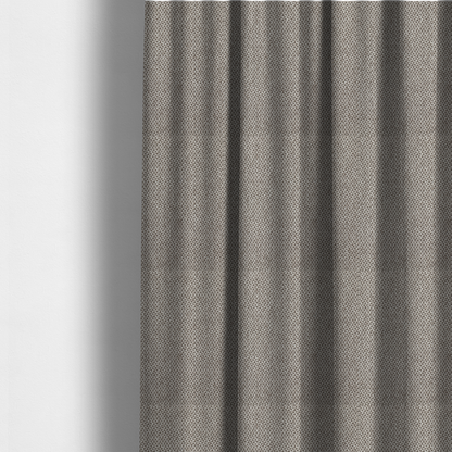 The fabric used to create these made-to-measure curtains is a fabric features a tight, structured basket weave in a versatile, mid-tone grey.