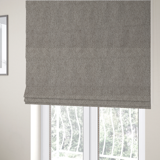 The fabric used to create these Roman blinds is a fabric features a tight, structured basket weave in a versatile, mid-tone grey.