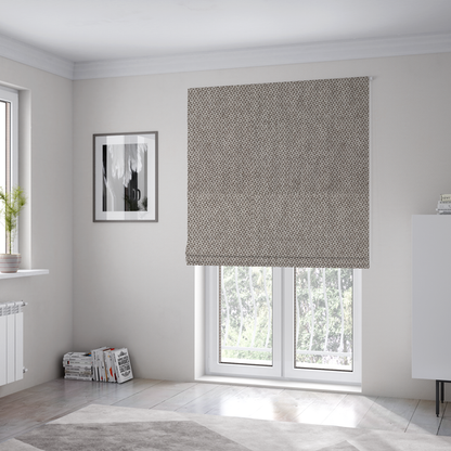 The fabric used to create these Roman blinds is a fabric features a tight, structured basket weave in a versatile, mid-tone grey.