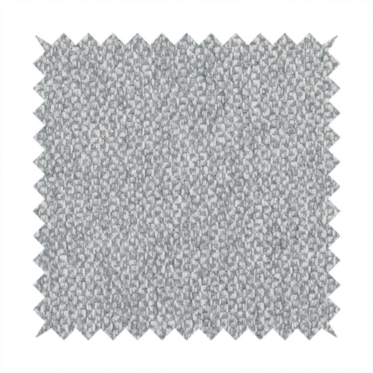 This fabric features a dimensional, textured weave in a cool, soft grey.