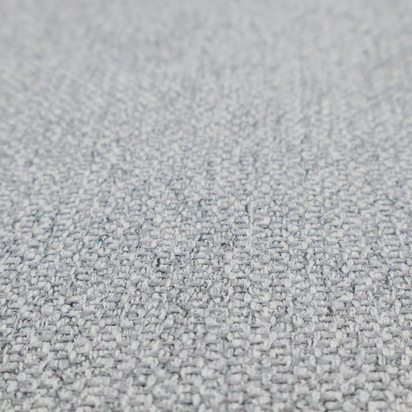 This fabric features a dimensional, textured weave in a cool, soft grey.
