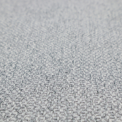 This fabric features a dimensional, textured weave in a cool, soft grey.