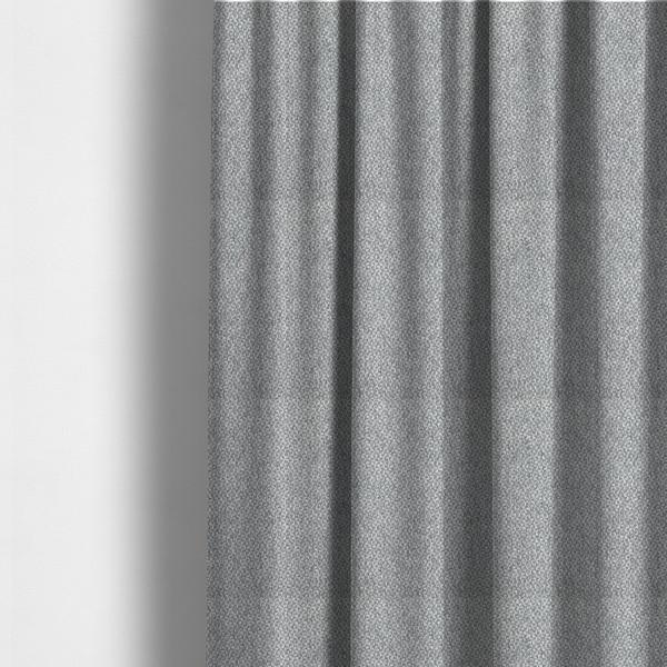 The fabric used to create these made-to-measure curtains is a fabric features a dimensional, textured weave in a cool, soft grey.