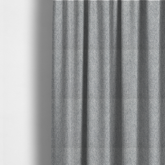 The fabric used to create these made-to-measure curtains is a fabric features a dimensional, textured weave in a cool, soft grey.