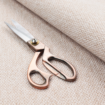 This fabric features a delicate, fine-grained basket weave in a soft, light blush or warm champagne tone.