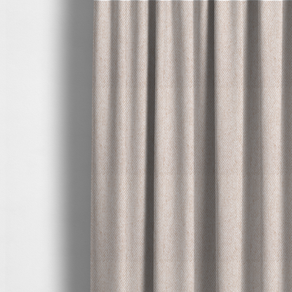 The fabric used to create these made-to-measure curtains is a fabric features a delicate, fine-grained basket weave in a soft, light blush or warm champagne tone.