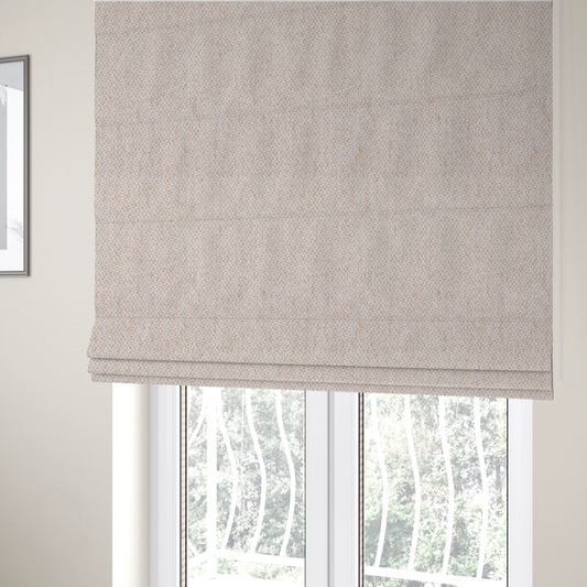 The fabric used to create these Roman blinds is a fabric features a delicate, fine-grained basket weave in a soft, light blush or warm champagne tone.