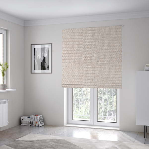 The fabric used to create these Roman blinds is a fabric features a delicate, fine-grained basket weave in a soft, light blush or warm champagne tone.