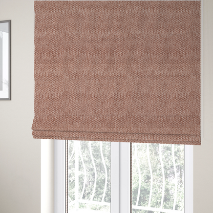 The fabric used to create these Roman blinds is a fabric features a tight, structured basket weave in a warm, muted copper or terra-cotta tone.