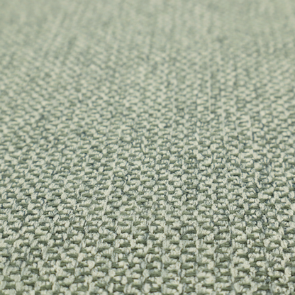 This fabric features a tight, structured basket weave in a soft, muted sage green.