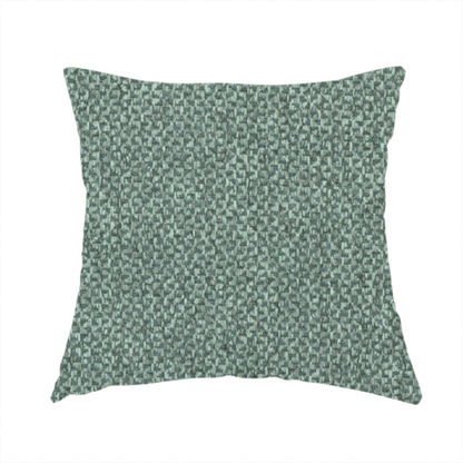 The fabric used to create this handmade cushion is a fabric features a tight, structured basket weave in a vibrant, deep green.