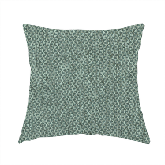 The fabric used to create this handmade cushion is a fabric features a tight, structured basket weave in a vibrant, deep green.