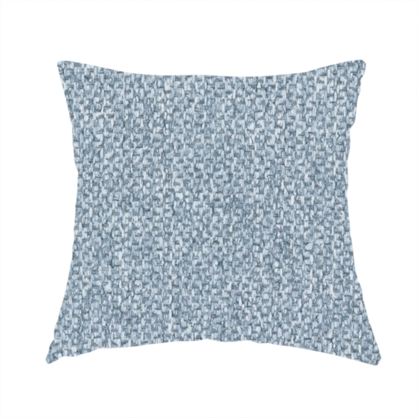 The fabric used to create this handmade cushion is a fabric features a tight, structured basket weave in a soft, cool-toned sky blue.
