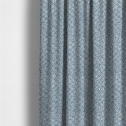 The fabric used to create these made-to-measure curtains is a fabric features a tight, structured basket weave in a soft, cool-toned sky blue.