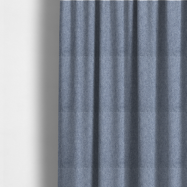 The fabric used to create these made-to-measure curtains is a fabric features a tight, structured basket weave in a rich, mid-tone slate blue.