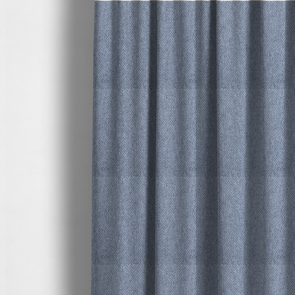 The fabric used to create these made-to-measure curtains is a fabric features a tight, structured basket weave in a rich, mid-tone slate blue.