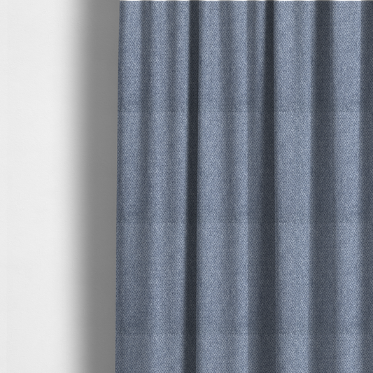 The fabric used to create these made-to-measure curtains is a fabric features a tight, structured basket weave in a rich, mid-tone slate blue.